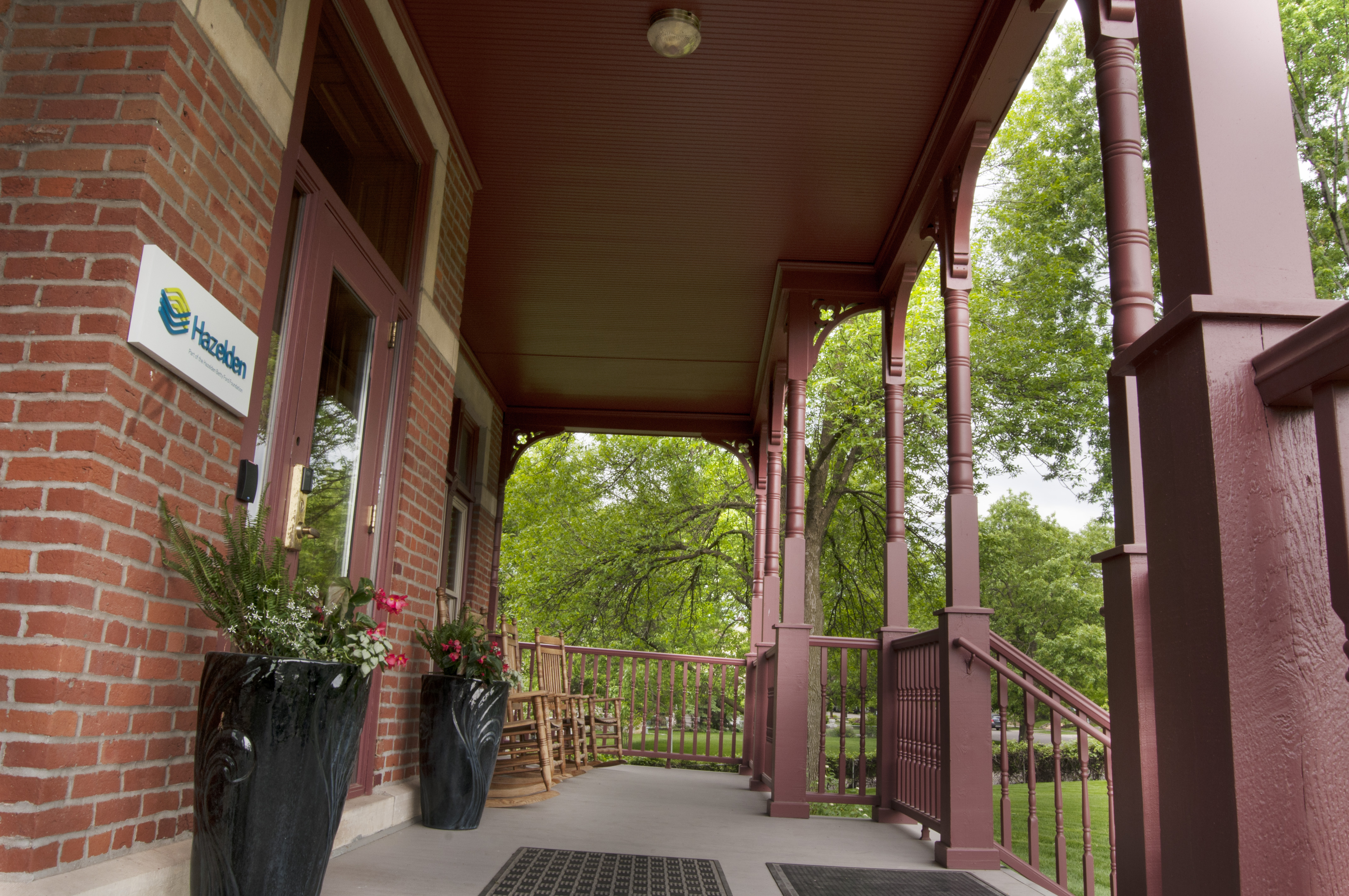 St. Paul porch with rocking chairs and planters