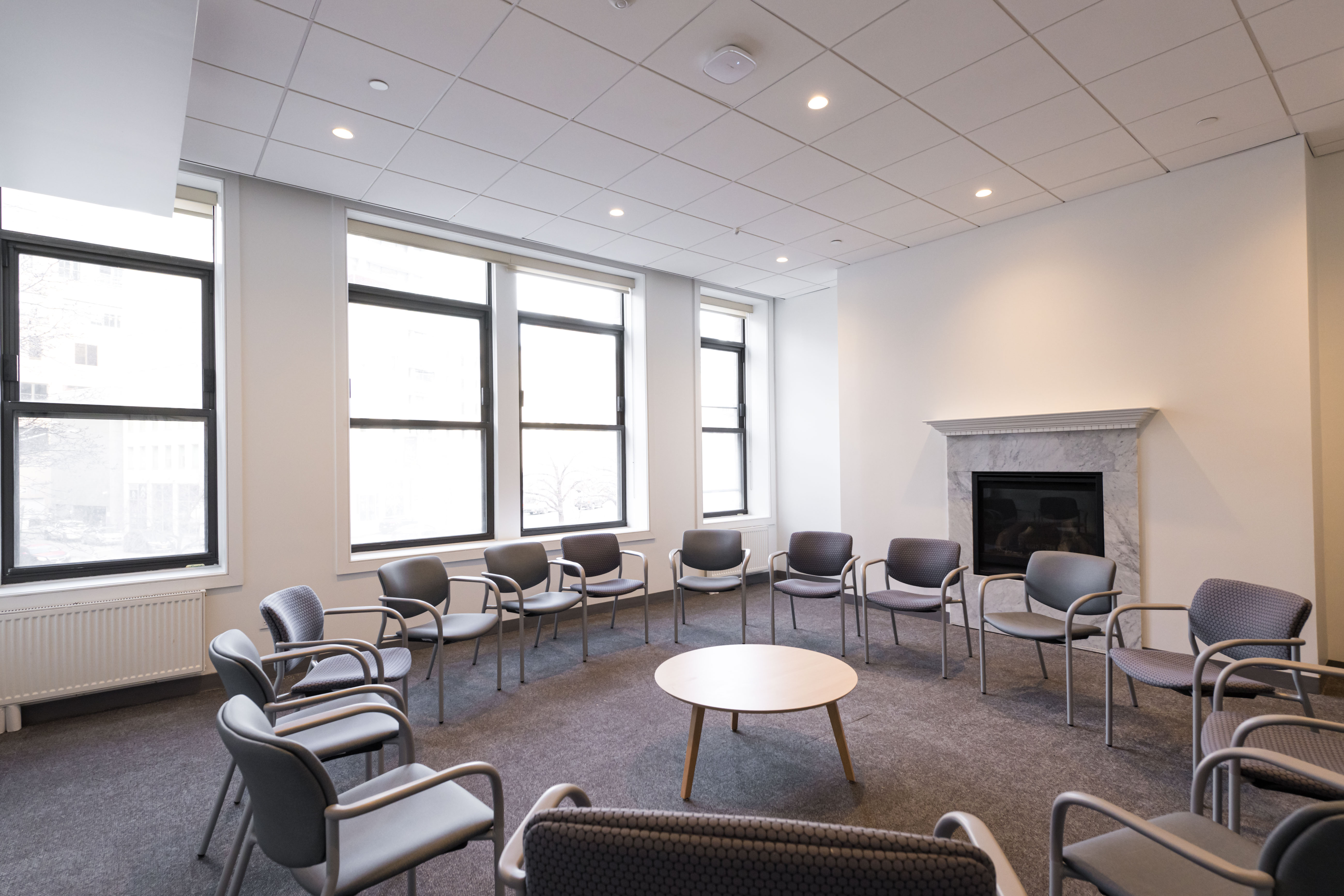 The Tribeca meeting room with bright windows and chairs arranged in a circle